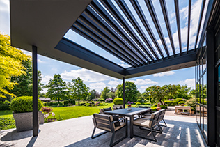 Pergola with retractable louvered roof